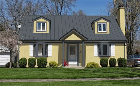 yellow house with gray metal roof|tin colors for homes.